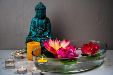 Aromatic bowl with candles and flowers