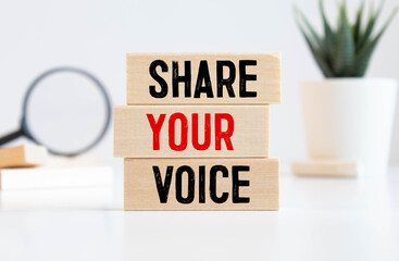 Share Your Voice text on a wooden cubes