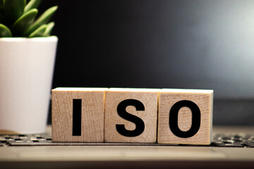 Wooden blocks with the word ISO. International organization for standardization.