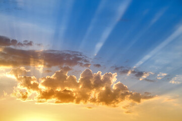 The golden cloudscape on sunset. - obrazy, fototapety, plakaty