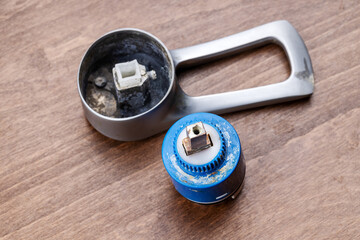 old clogged broken faucet cartridge. handyman repair leaky faucet. water tap fix service concept