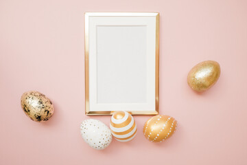 Frame with gold speckled easter eggs with copy space for text on pink background. Minimal Happy Easter concept. Top view, flatlay