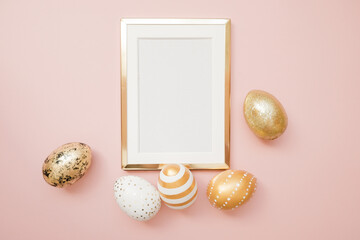 Frame with gold speckled easter eggs with copy space for text on pink background. Minimal Happy Easter concept. Top view, flatlay