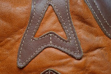 brown leather texture of patches and seams on clothes