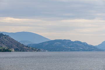 beautiful Okanagan lake with blue sky and white clouds summer day.