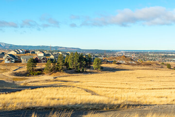 Fototapeta na wymiar A new subdivision being built on a hilltop in Liberty Lake with Sprague Avenue and downtown Spokane Washington in view behind.