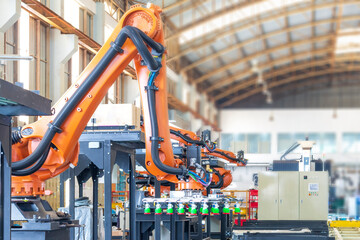 Factory 4.0 concept. Industrial robot in smart warehouse system for manufacture factory