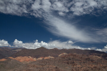 The Andes mountain range. Enchanting view of the rocky mountains and Humahuaca ravine under a majestic blue sky in Tilcara, Jujuy, Argentina.