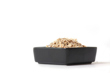 black bowl of granola isolated against white background. Healthy eating concept
