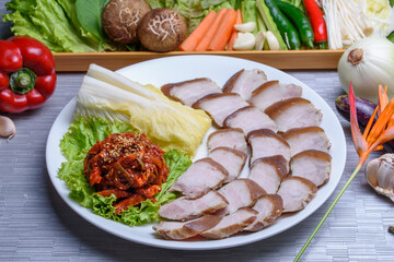 Thin steamed-sliced pork belly with vegetables, Bossam
