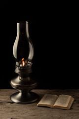 Old books and kerosene lamp