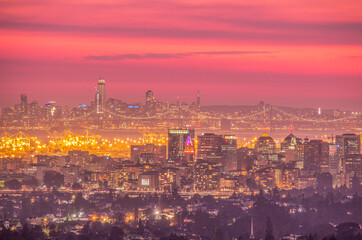 Fototapeta na wymiar Oakland With San Francisco in the Background During Sunset