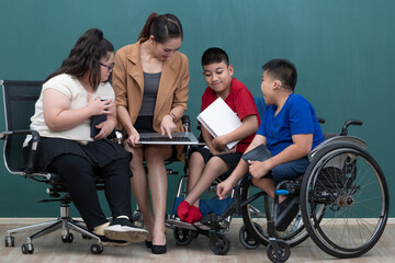 Portrait group of special kids classroom, disable and down syndrome boys, girl and teacher taking...