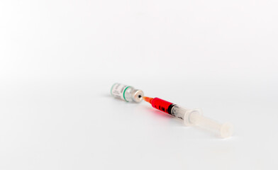 Syringe in a Allergen immunotherapy bottle. Corona virus vaccine, Health technology concept, syringe and a bottle isolate on white background with selective focus.