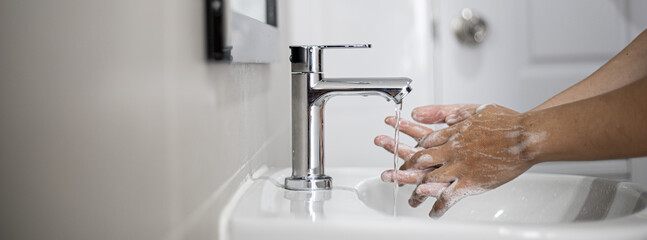 People washing their hands in the sink, washing their hands thoroughly is a precautionary measure against COVID-19 infection. Everyone washes their hands regularly in the right way.