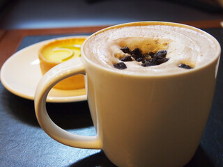 Latte and egg tart in the table