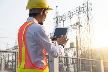 Engineer use tablet technology at power plant system