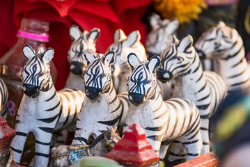 Fototapeta na wymiar Zebra statue sacrificial offering for thai god ,god toy,pray to thai god.Thailand