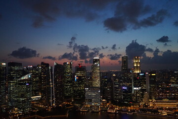 Fototapeta na wymiar Aerial view of Skyscraper and Marina Bay area at night in Singapore - シンガポール マリーナベイ エリア 夜景