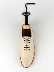 Wooden shoe lasts on a white background.