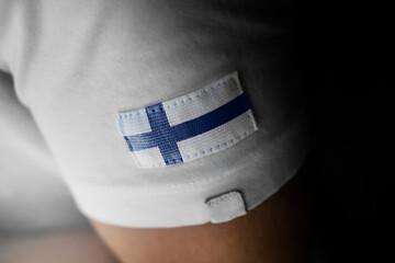 Patch of the national flag of the Finland on a white t-shirt