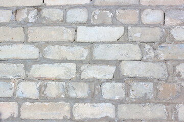 Background brick wall from white bricks close-up. 