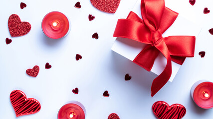 Valentines day gift box, red love hearts, romantic candle on white background. Romantic message...