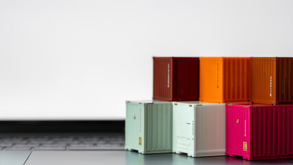 Global business container cargo ship in import export business logistic, Company shipping delivery and logistics technology business industrial, Container on computer laptop notebook selective focus.