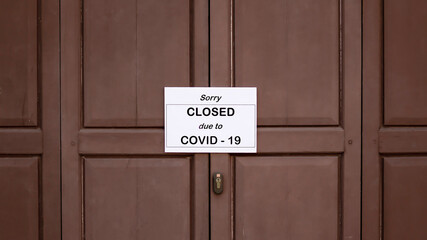 The sign in front of the office is temporarily closed.