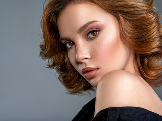 Beautiful face of an white woman. Beautiful brown haired with stylish short hairstyle. Woman with a...