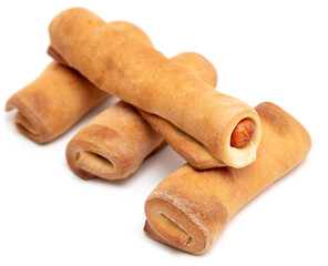 Sausages in dough isolated on white