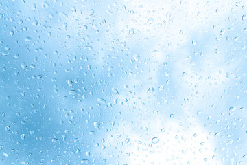 Water drops or Rain drops on glass with blue filter