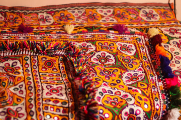 handwork embroidery,Handmade embroidery art. Traditional Indian handmade embroidery art,selective focus,mirror work colorful handmade ahir bharat,Kutch-gujarat