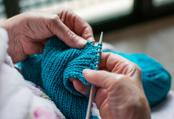 Close-up Of The Hands Of An Old Woman Weaving. Elderly Person Doing Chores.