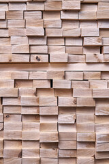 Large stack of new boards of natural solid birch for table legs production in contemporary carpentry warehouse close view