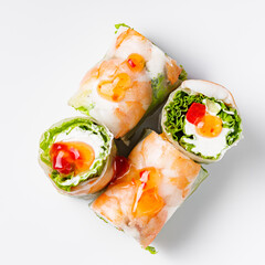 appetizing spring rolls with sea food and philadelphia cheese on a white background