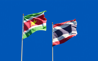 Obraz premium Flags of Suriname and Thailand.
