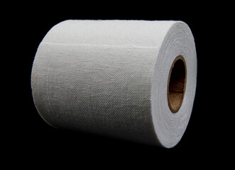 Medical sticking plaster roll isolated on black. First aid item