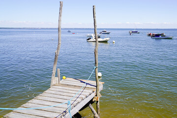 boat parked at low tide in bay Arcachon beach France in Le Canon oyster farm Village