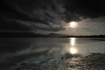 Obraz premium sunset over the gilimanuk bay