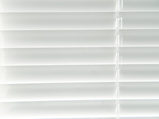white blinds close up on a sunny day window background