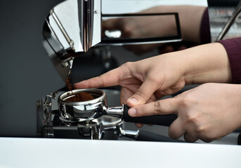 Filter holder filled with freshly ground coffee. Espresso accessory.