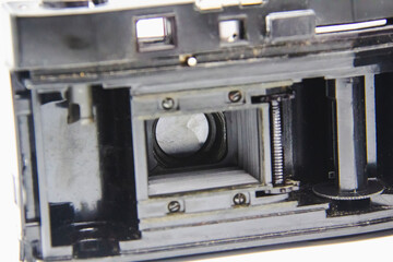 Vintage old photo camera from inside on the white background