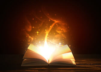 Open magic book on dark background © Pixel-Shot
