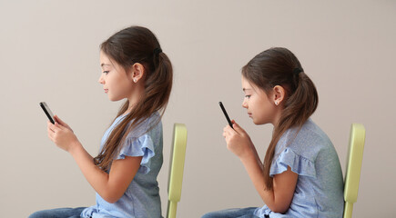 Little girl with bad and proper posture using mobile phone on grey background