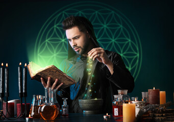 Male alchemist making potion on dark background