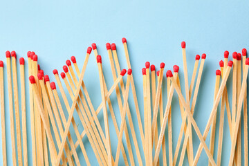 Many wooden matches on color background