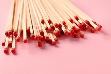 Many wooden matches on color background