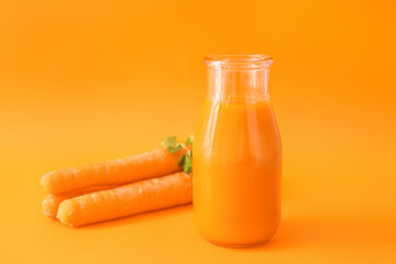 Jar of tasty carrot juice on color background