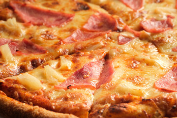 Pizza with ham and cheese filling close-up. Italian food concept. Appetizing pizza.